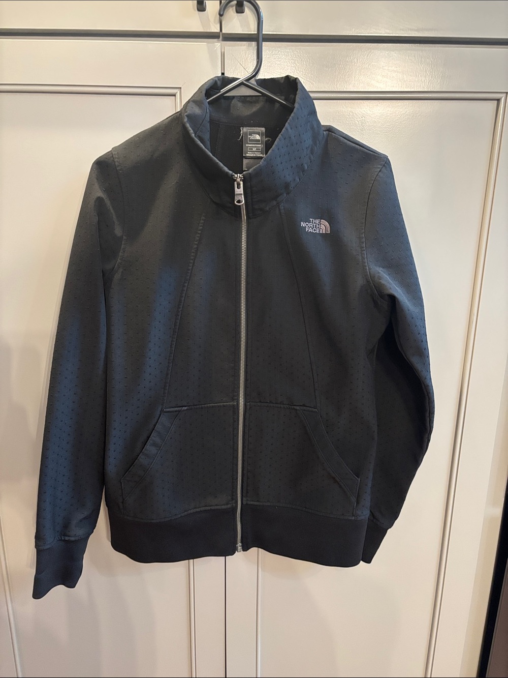 Woman’s North Face black zipped jacket S